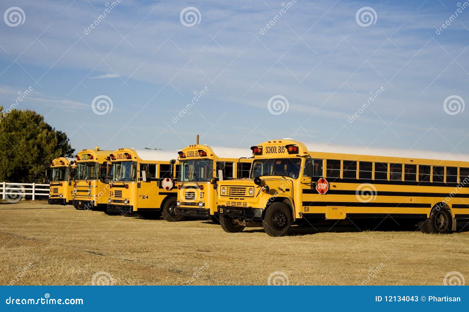 school-buses-parked-outside-school-12134043.jpg