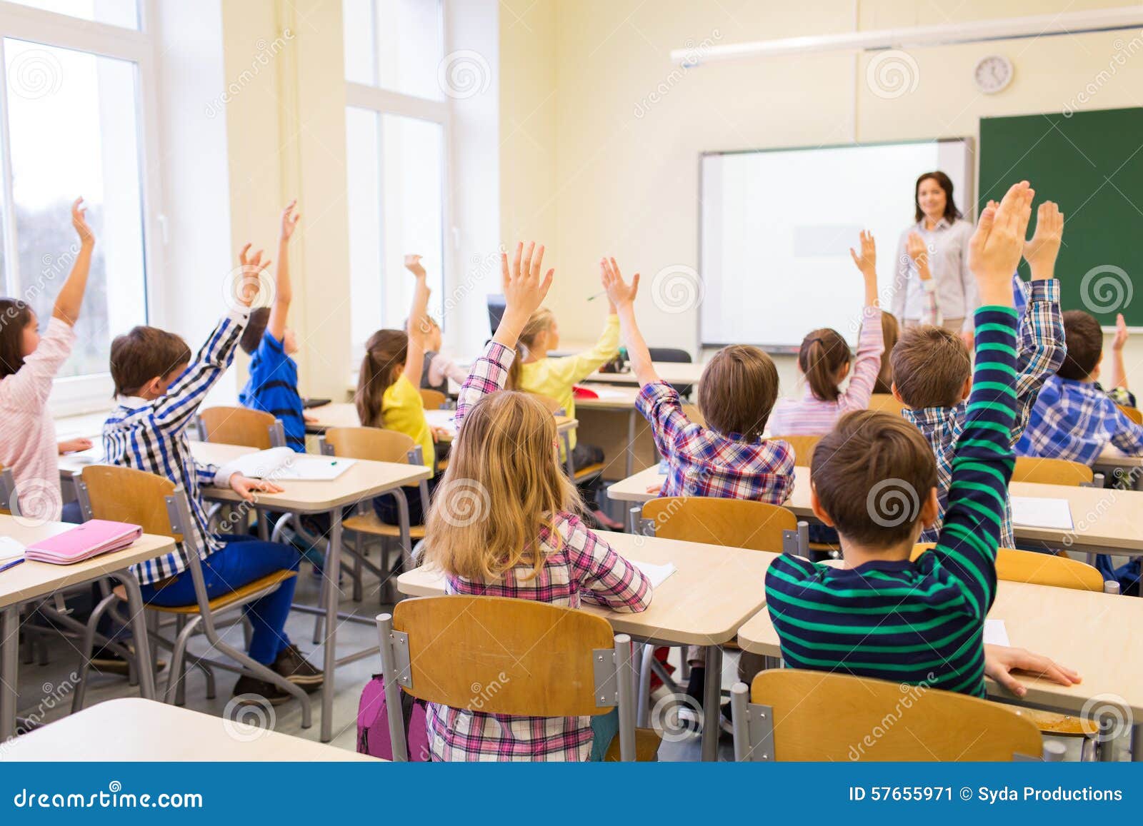 group-school-kids-raising-hands-classroom-education-elementary-learning-people-concept-teacher-sitting-57655971.jpg